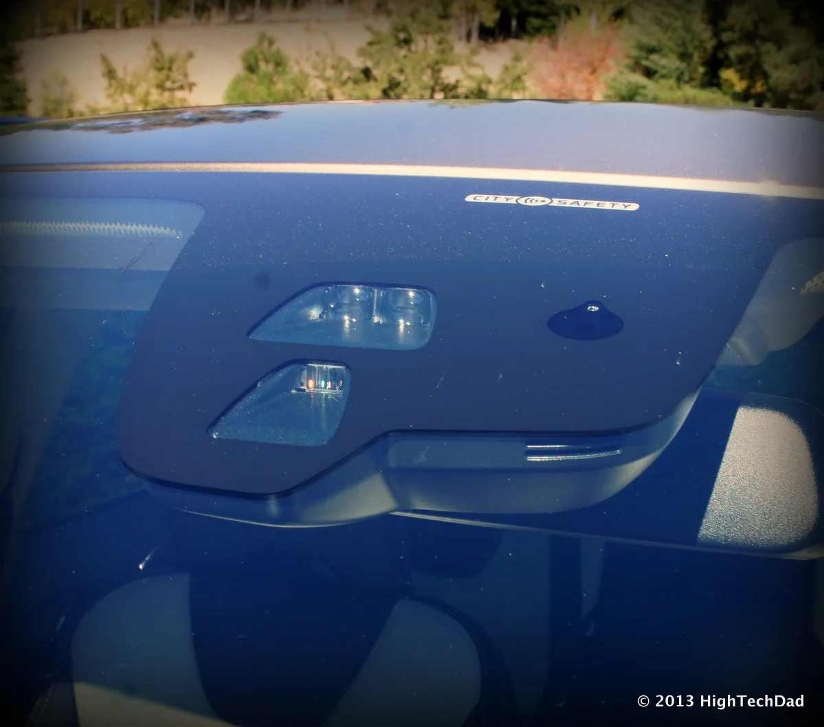 Forward-facing ADAS camera module mounted on a vehicle windshield