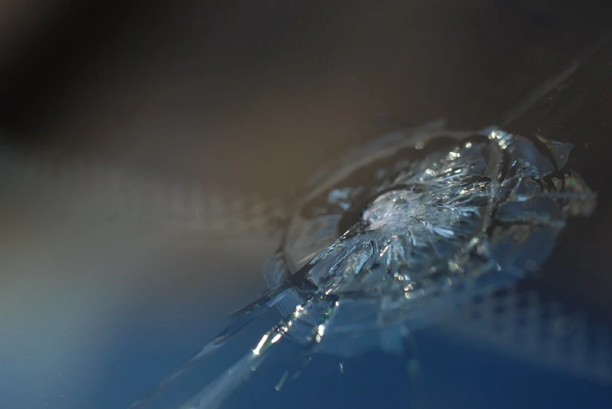 Close-up of a rock chip in a windshield