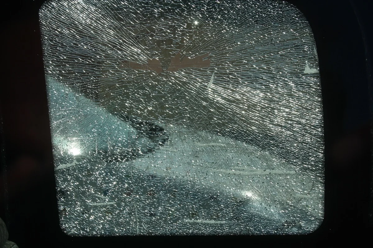 Shattered tempered car side window requiring replacement